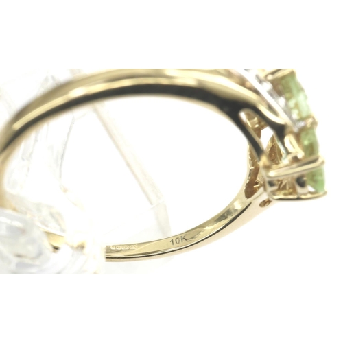 20 - 10ct gold emerald trilogy ring set with CZ stones, size N/O, 2.4g. P&P Group 1 (£14+VAT for the firs... 