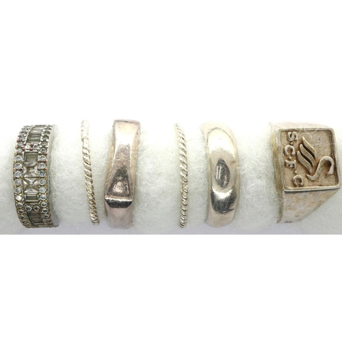21 - Six 925 silver rings including a S.C.F.C signet ring, sizes P-Y. P&P Group 1 (£14+VAT for the first ... 