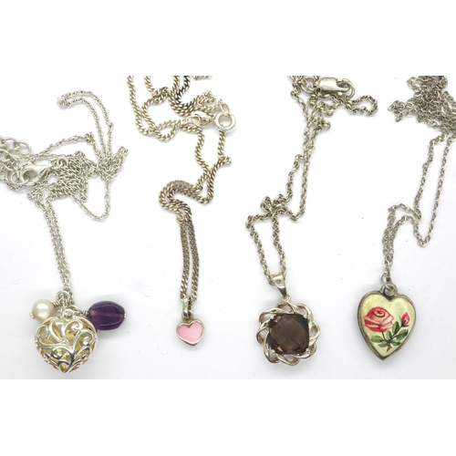 31 - Four 925 silver pendant necklaces including a pierced heart pendant, largest chain L: 48 cm. P&P Gro... 