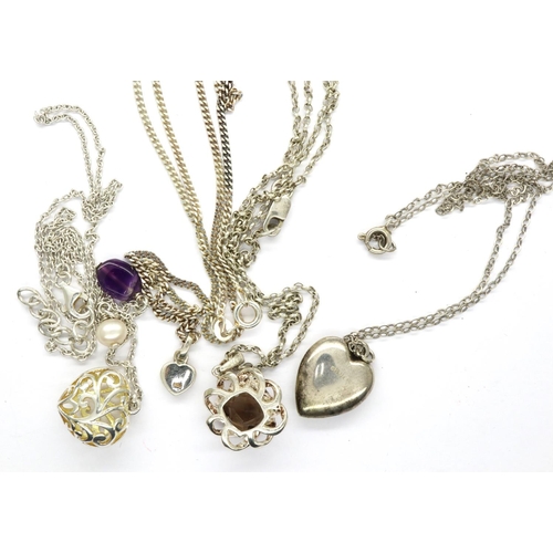 31 - Four 925 silver pendant necklaces including a pierced heart pendant, largest chain L: 48 cm. P&P Gro... 