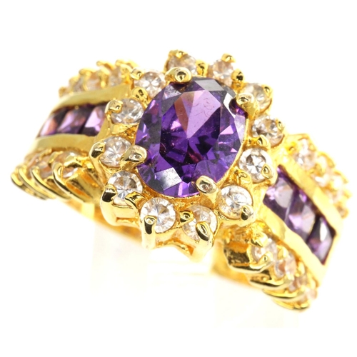 32 - 10ct gold flower ring set with amethyst and CZ stones, size P, 6.9g. P&P Group 1 (£14+VAT for the fi... 