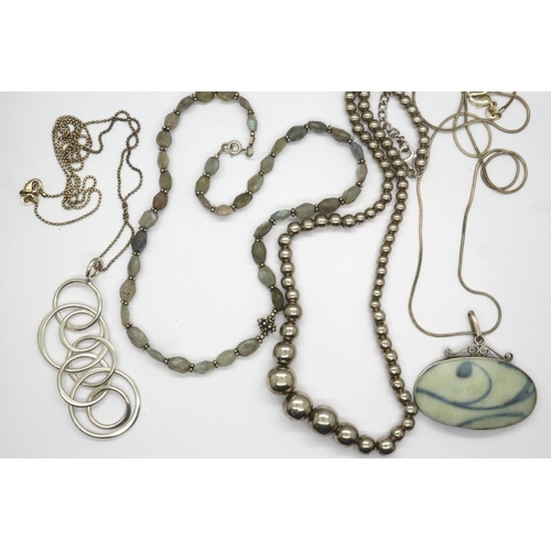 59 - Four 925 silver necklaces including beaded examples, longest chain L: 70 cm. P&P Group 1 (£14+VAT fo... 