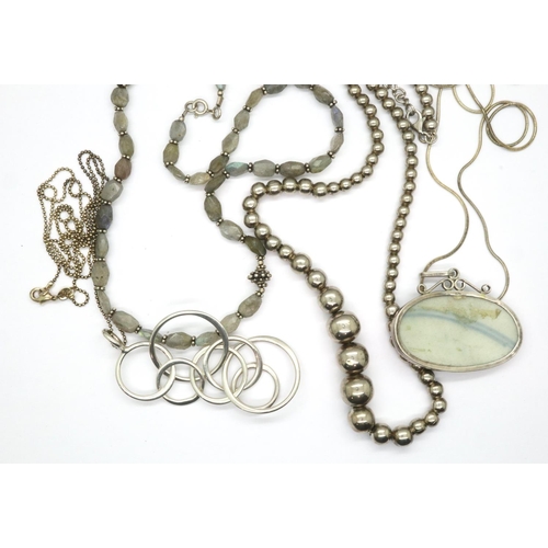 59 - Four 925 silver necklaces including beaded examples, longest chain L: 70 cm. P&P Group 1 (£14+VAT fo... 