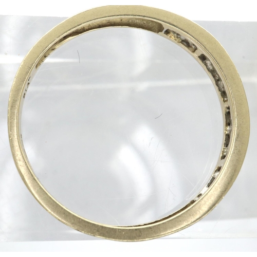 62 - 9ct gold band set with nine graduating diamonds, size N/O, 1.3g. P&P Group 1 (£14+VAT for the first ... 