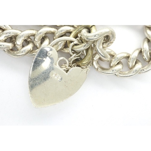 91 - 925 silver heavy link bracelet with a 925 silver padlock clasp, L: 20 cm. P&P Group 1 (£14+VAT for t... 