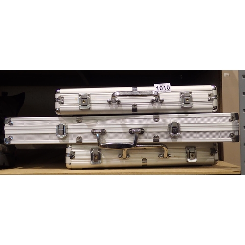 1010 - Three poker sets in aluminium cases. Not available for in-house P&P