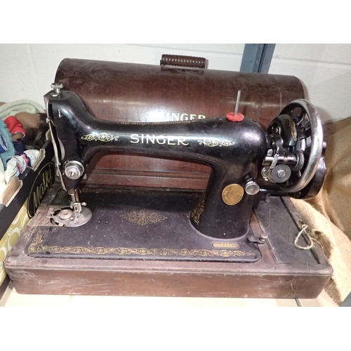 1051 - Oak cased Singer hand crank sewing machine. Not available for in-house P&P
