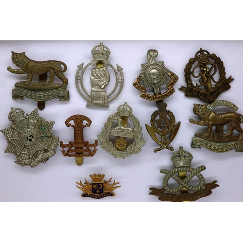 2146 - Four WWI British military cap badges and enamelled sweetheart badge and six British WWII cap badges,... 