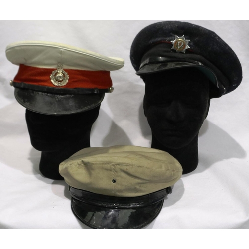 2027 - A Czechoslovakian M53 steel helmet with leather liner and chin strap with a further helmet and three... 