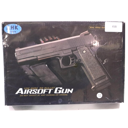 2187 - New old stock airsoft pistol model V19 tan, unopened. P&P Group 2 (£18+VAT for the first lot and £3+... 