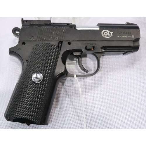 2202 - Colt Defender Co2 air pistol, cased, with cartridges, targets and BBs. P&P Group 3 (£25+VAT for the ... 