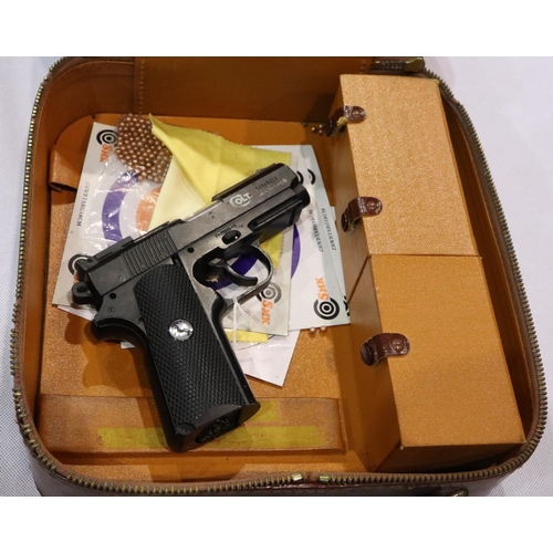 2202 - Colt Defender Co2 air pistol, cased, with cartridges, targets and BBs. P&P Group 3 (£25+VAT for the ... 