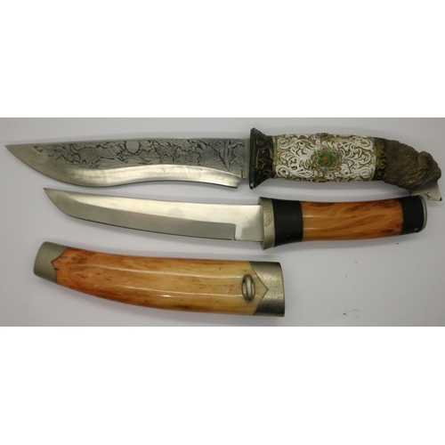 2207 - A modern Bowie style hunting knife with engraved blade and carved handle (lacking scabbard), togethe... 