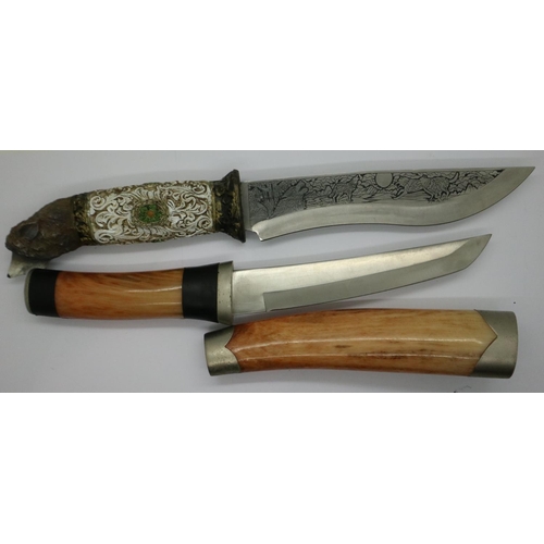 2207 - A modern Bowie style hunting knife with engraved blade and carved handle (lacking scabbard), togethe... 