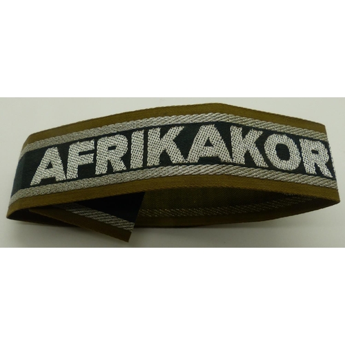 2080I - Embroidered cuff title: Afrika Korps. P&P Group 1 (£14+VAT for the first lot and £1+VAT for subseque... 