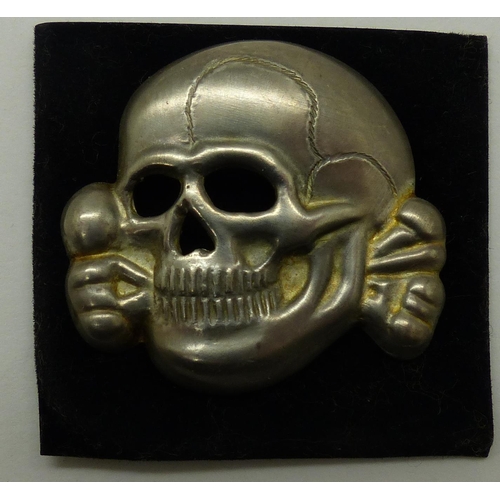 2170E - SS Totenkopf deaths head pressed metal badge. P&P Group 1 (£14+VAT for the first lot and £1+VAT for ... 