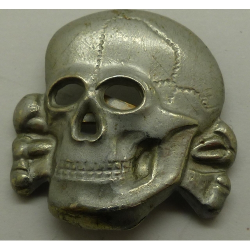 2170N - German pressed metal SS Totenkopf deaths head badge. P&P Group 1 (£14+VAT for the first lot and £1+V... 