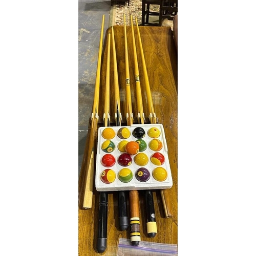 2183D - Six assorted snooker cues, cue holder and set of American pool balls. Not available for in-house P&P