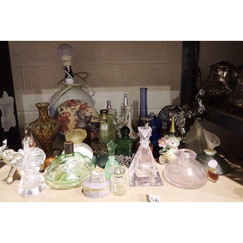 1066 - Quantity of mixed ceramics and glass, mainly empty perfume bottles including Jean Paul Gaultier. Not... 