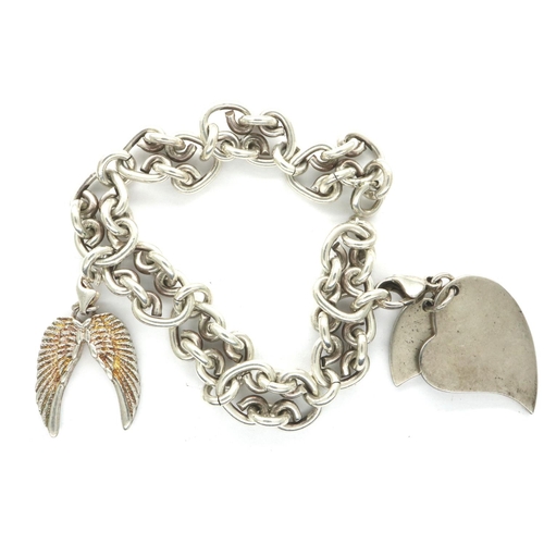 13 - 925 silver charm bracelet with two charms, bracelet L: 20 cm. P&P Group 1 (£14+VAT for the first lot... 