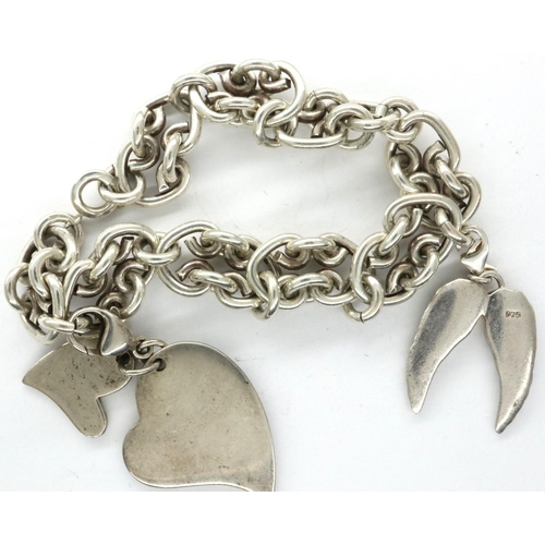 13 - 925 silver charm bracelet with two charms, bracelet L: 20 cm. P&P Group 1 (£14+VAT for the first lot... 