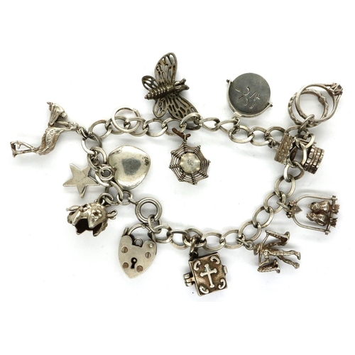 37 - 925 silver charm bracelet with hallmarked silver padlock clasp and twelve charms, chain L: 18 cm. P&... 