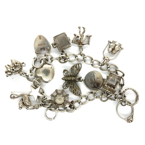 37 - 925 silver charm bracelet with hallmarked silver padlock clasp and twelve charms, chain L: 18 cm. P&... 