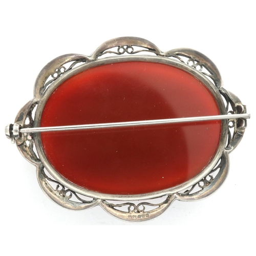 46 - Large hallmarked silver brooch set with an oval panel of carnelian, L: 60 mm. P&P Group 1 (£14+VAT f... 