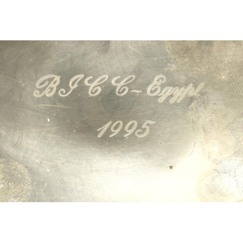 99 - Continental silver presentation bowl with scalloped edge, raised on three ball feet, inscribed, mark... 