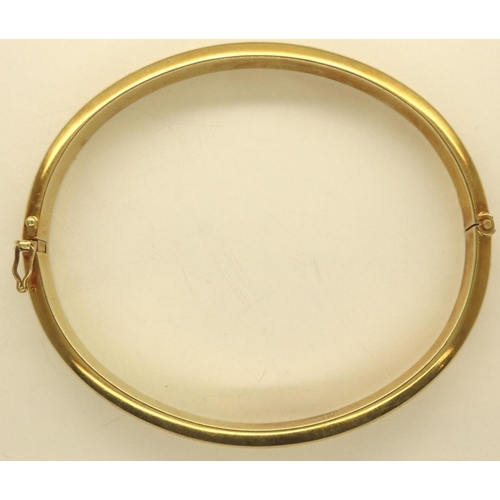 60 - 14ct gold snap bangle, 14.9g. P&P Group 1 (£14+VAT for the first lot and £1+VAT for subsequent lots)