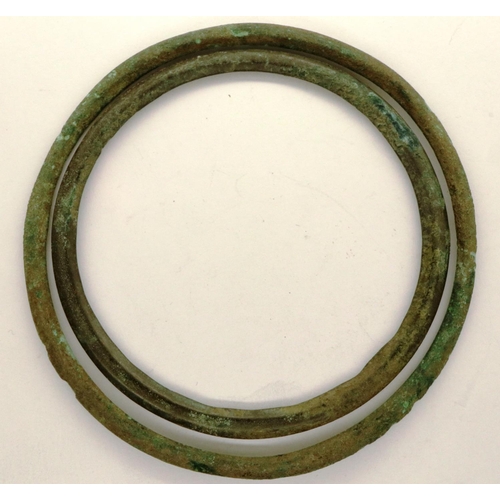 118 - Two bronze torc/bracelets, presumed Viking, L: 80 mm. P&P Group 0 (£5+VAT for the first lot and £1+V... 