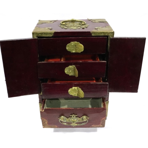 297 - Oriental lacquered jewellery cabinet with brass mounts, set with panels of carved jade, 18 x 13 x 24... 