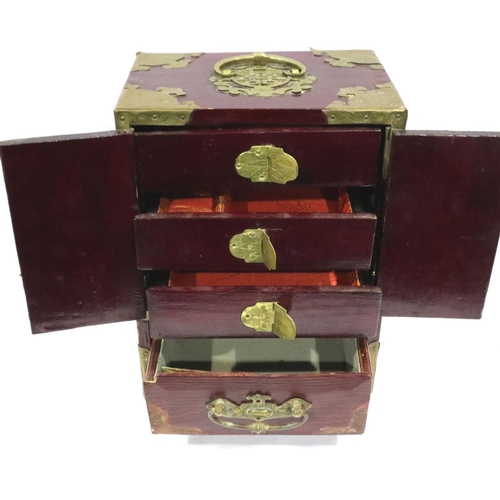 297 - Oriental lacquered jewellery cabinet with brass mounts, set with panels of carved jade, 18 x 13 x 24... 