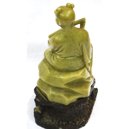 298 - Carved soapstone figurine of a seated lady with a flute, H: 15 cm, no damages. P&P Group 1 (£14+VAT ... 