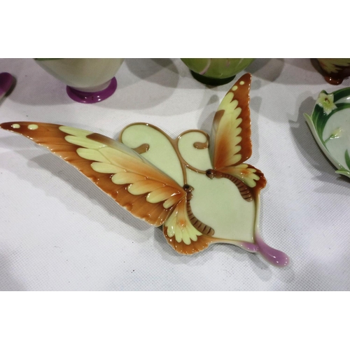 257 - Two Franz butterfly cups and saucers, and a butterfly teaspoon and vase, no chips or cracks, no craz... 