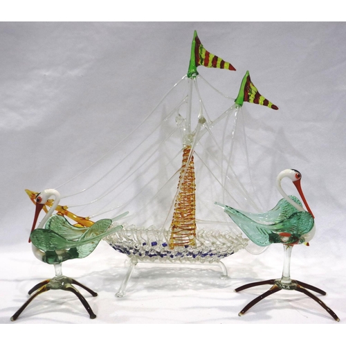 307 - Three pieces of glass in the Murano style, two storks and a ship, H: 21 cm, no visible damages, glas... 