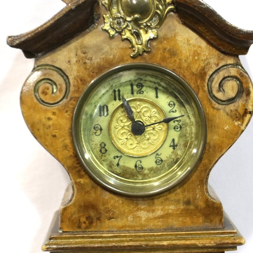 341 - Unusual shaped walnut cased mantle clock with brass detailing in relief, not working at lotting, H: ... 