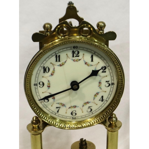 346 - Enamel face brass anniversary clock in a glass dome, H: 32 cm, not working at lotting. Not available... 