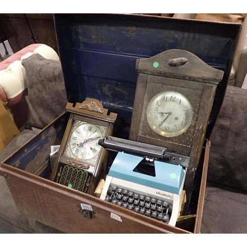 1551 - Vintage tin travel trunk containing two wall clocks and a Lilliput typewriter, 73 x 47 x 40 cm H. No... 