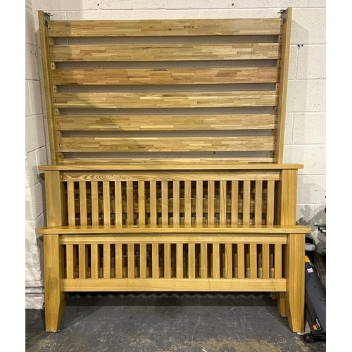 1607 - Oak king size bed frame with headboard and footboard with a mattress. Not available for in-house P&P