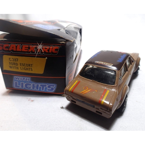 2012 - Two Scalextric cars with lights, C287 Ford Escort, brown, Westwood Racing, and C288 Porsche, silver,... 