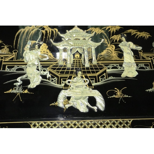 2094 - A 20th century black lacquered Oriental coffee table, glass top above a Shibyama and gilt panel with... 