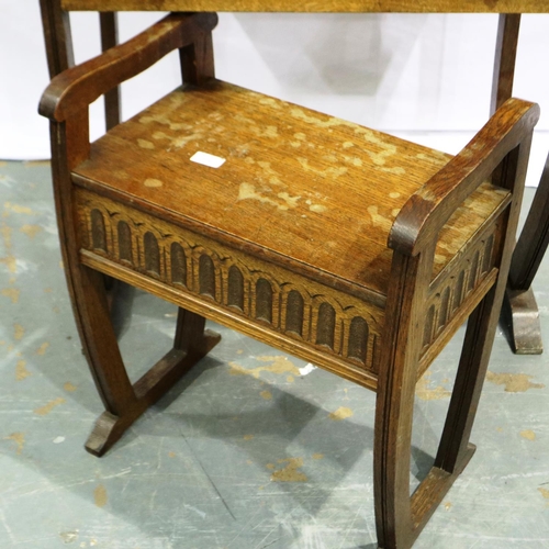 2103 - An early 20th century oak writing desk, gadrooned in the priory style with two drawers (one conceale... 