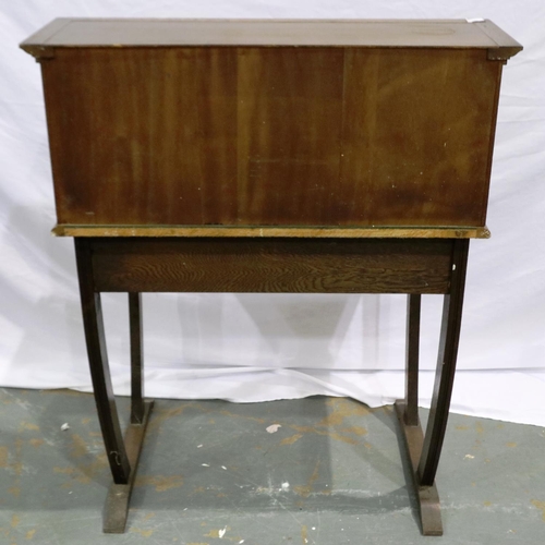 2103 - An early 20th century oak writing desk, gadrooned in the priory style with two drawers (one conceale... 