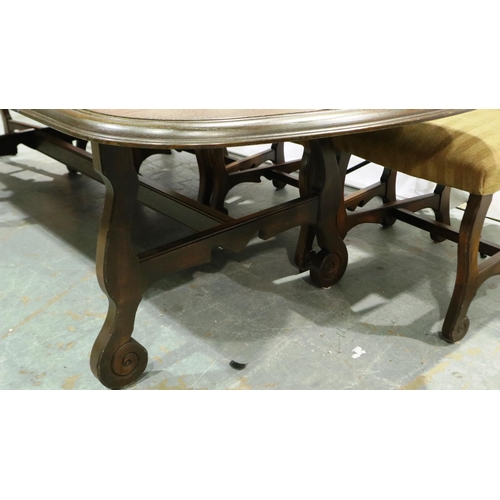 2105 - A 20th century Spanish oak extending dining table with a set of ten upholstered high back dining cha... 