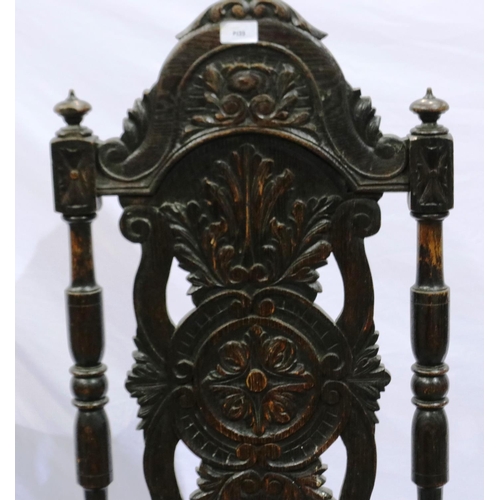 2107 - 19th century Jacobean Revival oak hall chair, with profusely carved backrest and seat. Not available... 