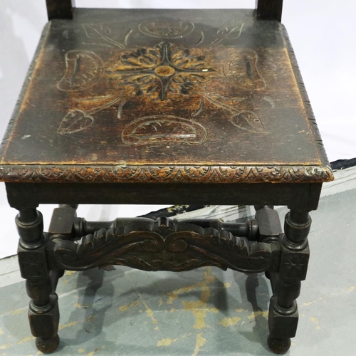 2107 - 19th century Jacobean Revival oak hall chair, with profusely carved backrest and seat. Not available... 