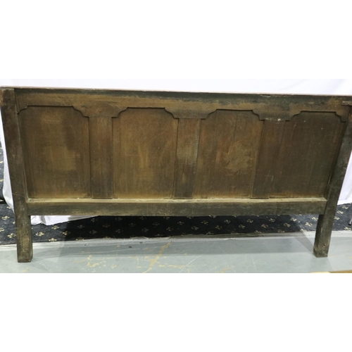 2108 - An 18th/19th century panelled oak settee with later upholstered seat cushion, L: 185 cm. Not availab... 