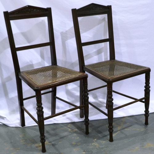 2109 - Pair of early 20th century mahogany bedroom chairs, each with bergere seats and turned supports. Not... 