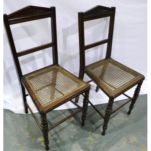 2109 - Pair of early 20th century mahogany bedroom chairs, each with bergere seats and turned supports. Not... 